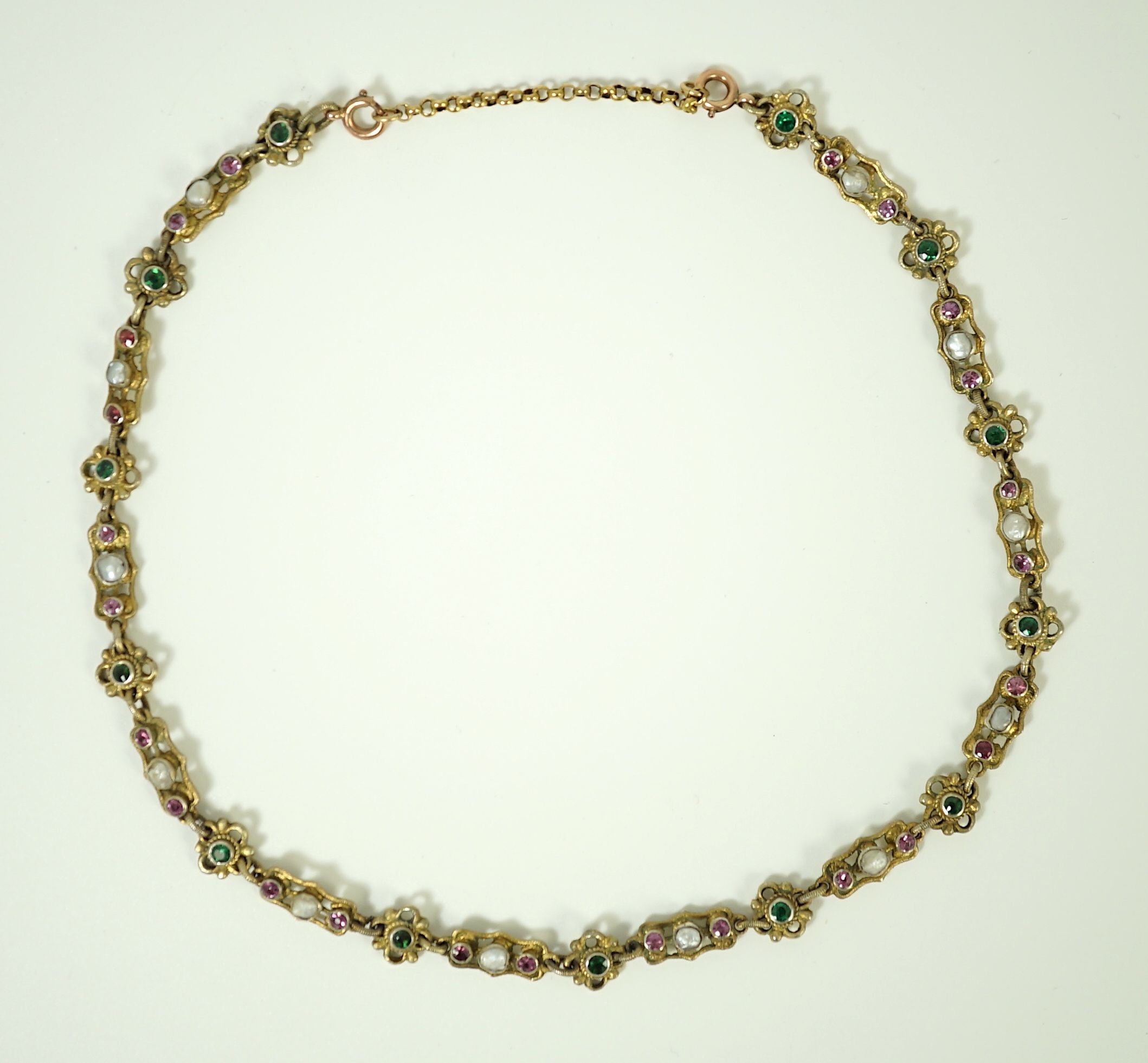 An early 20th century pierced and engraved silver gilt and gem set choker necklace, in the Suffragette colours